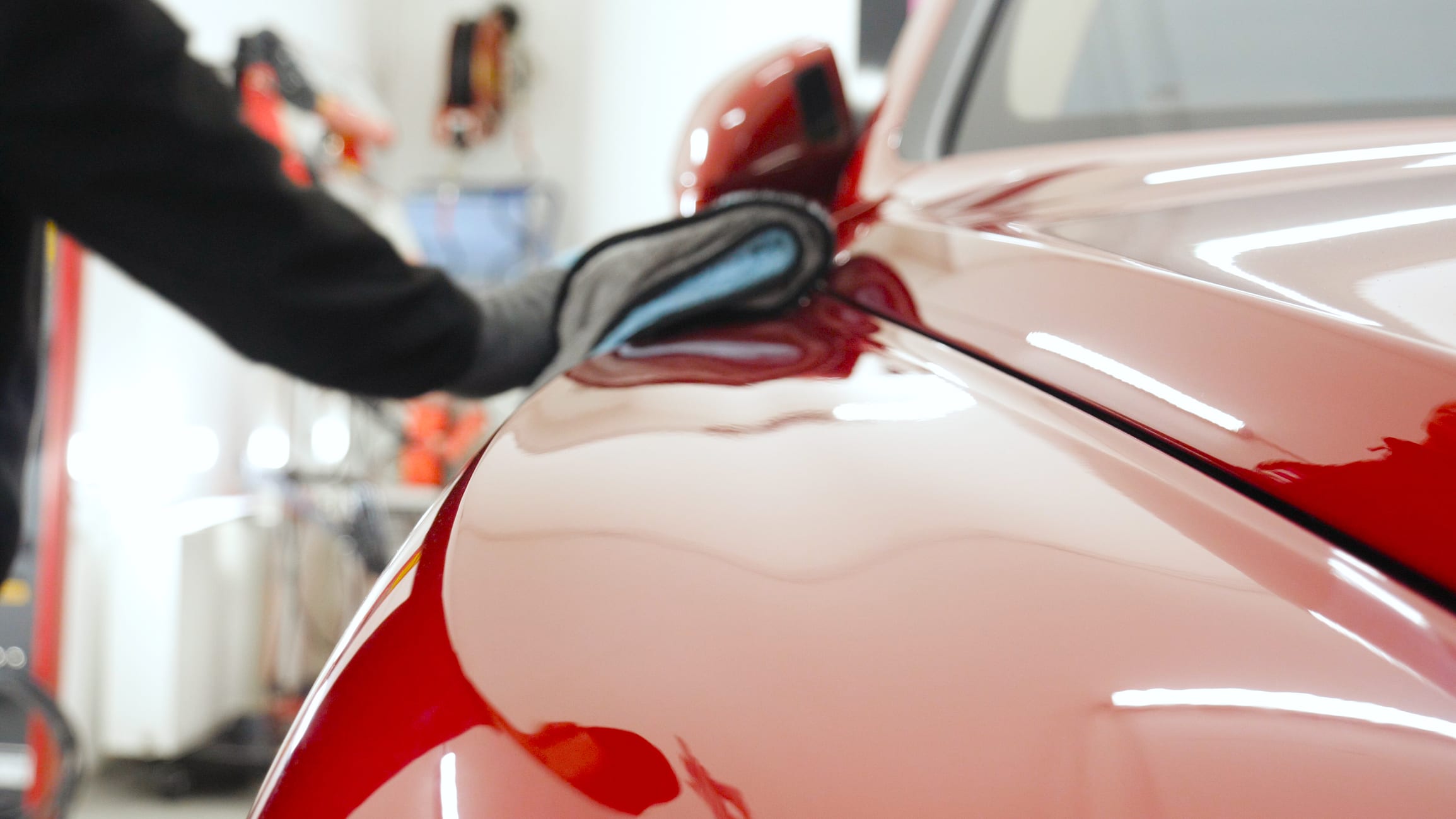 waxing car at a diy car wash